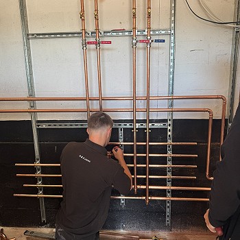 man working on the heating plumbing